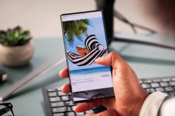 a man scrolling through travel posts on social media, deciding where to go, which is step one on our international travel checklist