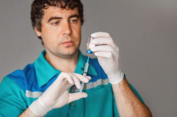 Doctor in Russia holding syringe