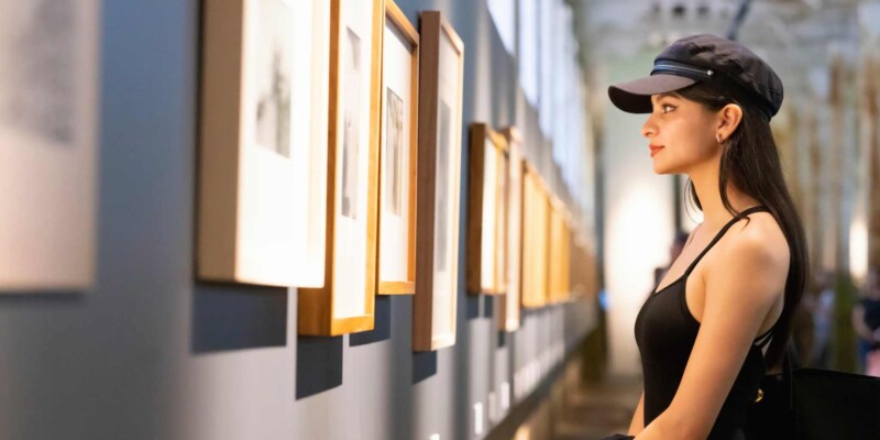 a woman alone in a gallery during off peak season