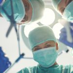 Surgeons preparing to perform surgery for expats