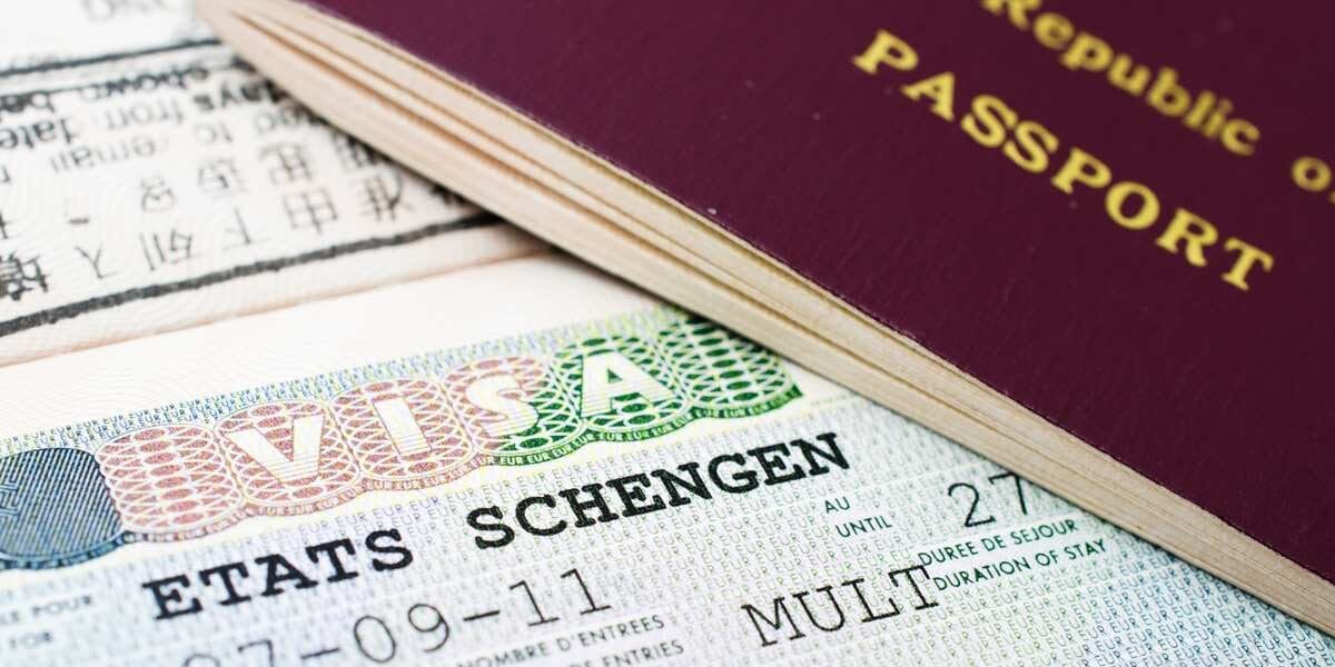 A close-up of a Schengen States visa, which travelers should consider alongside the best travel insurance for international trips