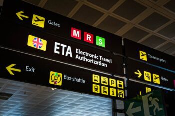 a UK ETA sign at an international airport in the UK