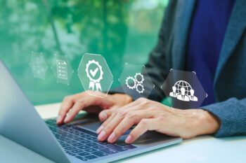 hands on a laptop keyboard using tools to compare international insurance