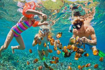 a family snorkeling in Costa Rica, one of the best family vacation ideas in 2025