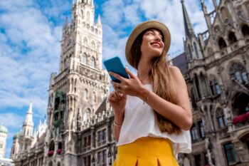 a young girl standing in front of Munich Cathedral, having obtained an ETIAS for European travel