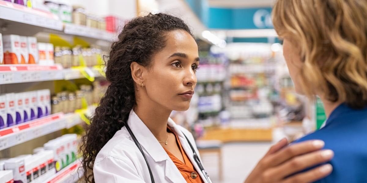 a pharmacist helping a customer in a pharmacy