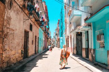 Tourist woman walking on a street of Old Havana