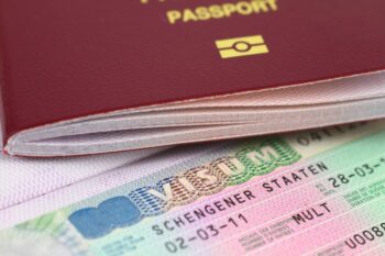 close-up of a Schengen Visa and passport
