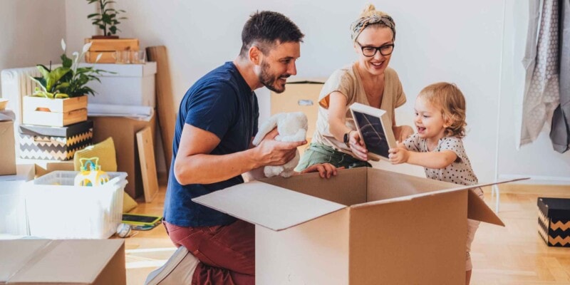 a young family packing up their belongings to move abroad
