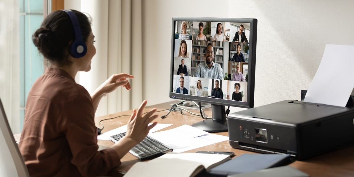 a woman joining a team meeting online, illustrating the advantage of partnering with an international PEO to hire and manage global talent