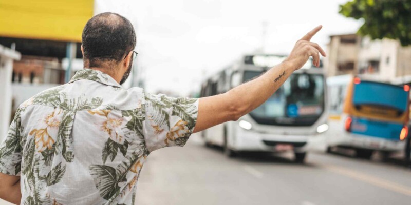 a man waiting at a bus stop in Brazil