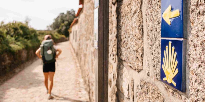 a female backpacker hiking the 'Camino de Santiago' in Galicia, Spain
