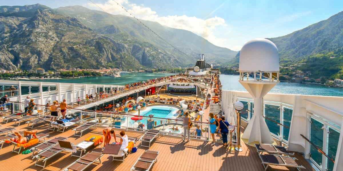 the top deck of a crowded cruise ship on a sunny day
