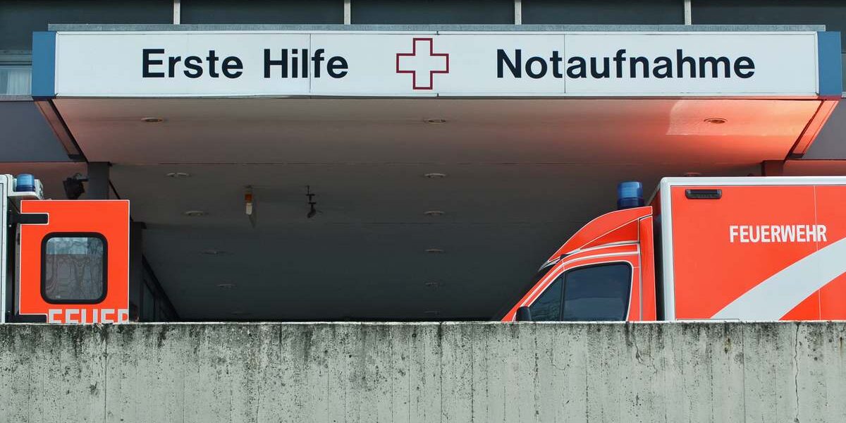 emergency department with two ambulance cars in Berlin, signalling the importance of buying travel insurance for Germany before you visit