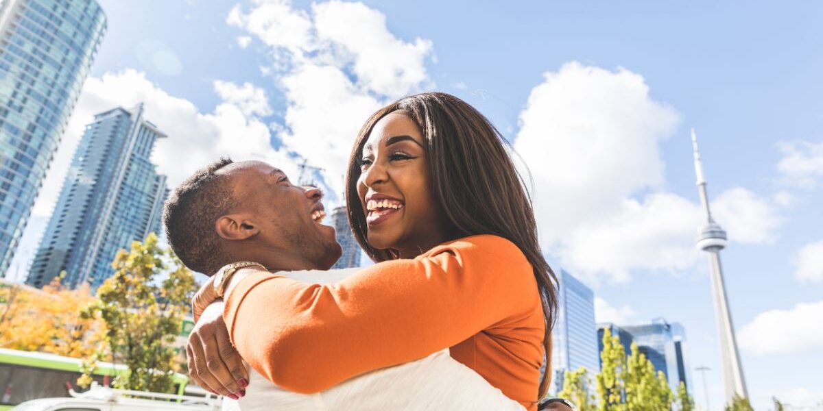 Happy black couple having fun in Toronto city