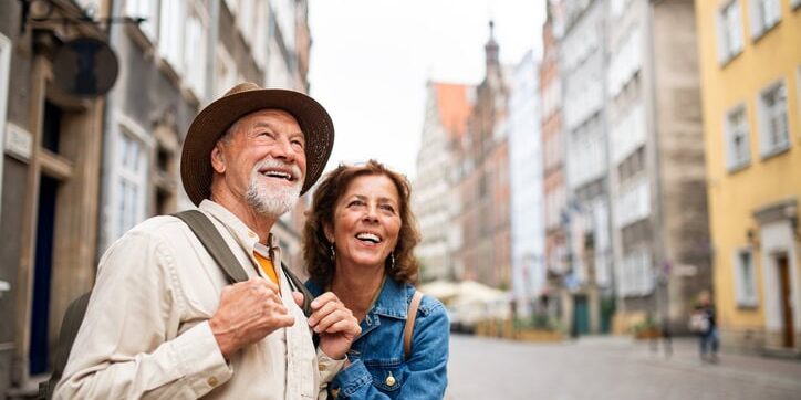 Happy, senior couple enjoying one of their trips, while knowing they are protected by the best travel insurance for seniors.