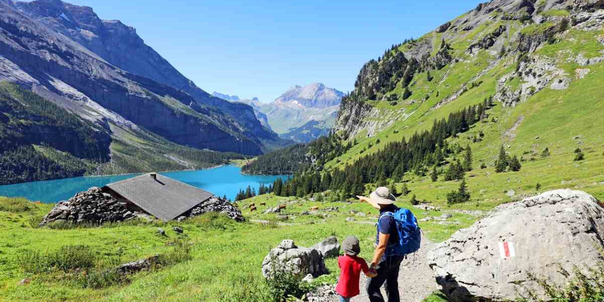 a father and son hiking in the Swiss Alps in Switzerland, one of the healthiest countries in the world