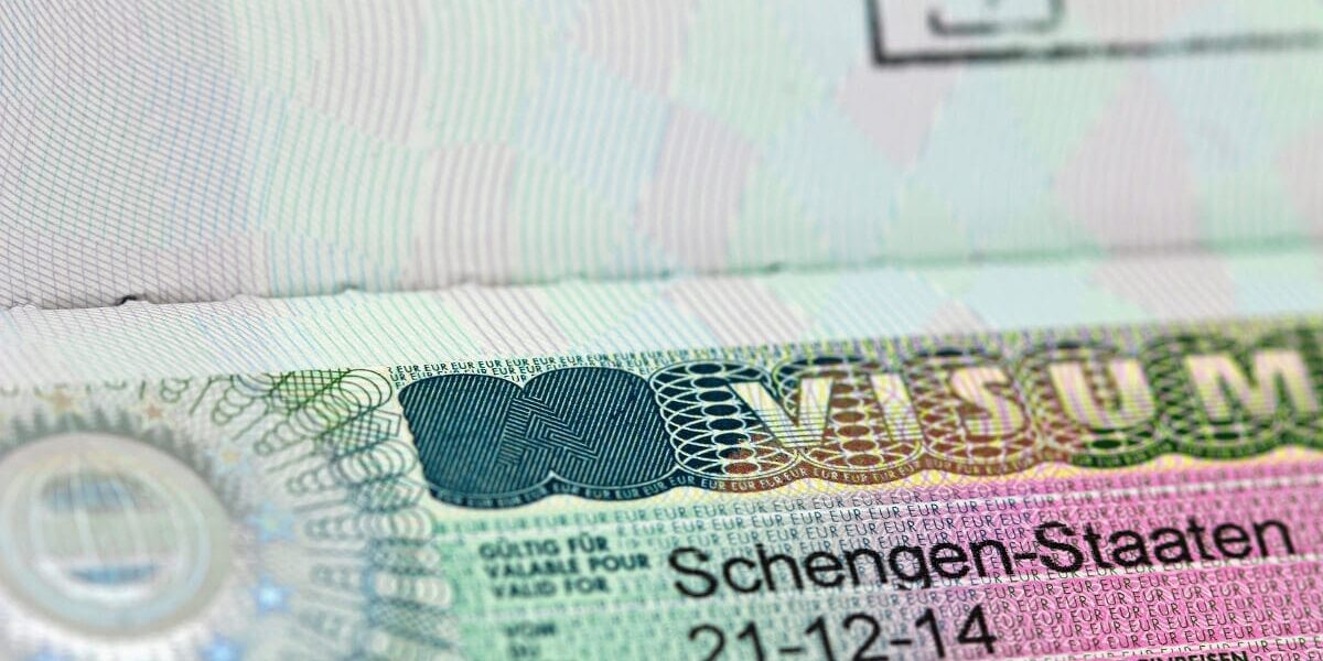 a close-up of a Schengen visa, which requires specific Schengen visa insurance
