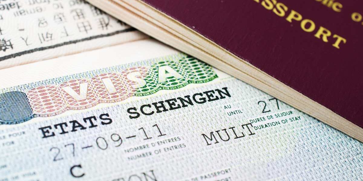 A close-up of a Schengen States visa, which travelers should consider alongside the best travel insurance for international trips