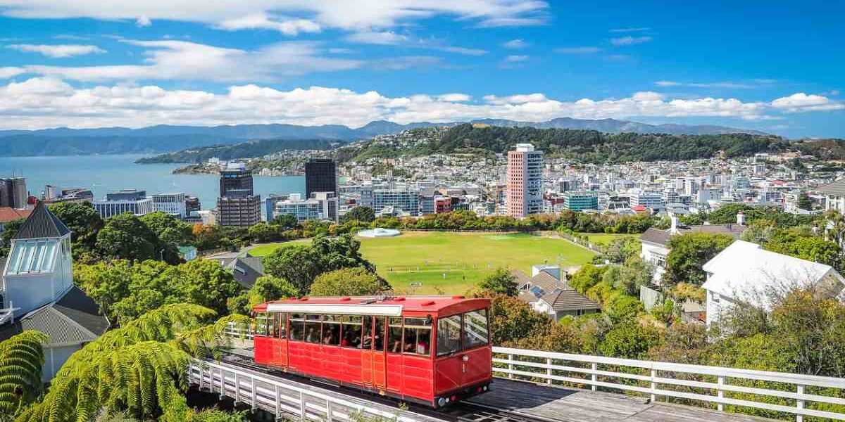 A cable car traveling towards the city of Wellington, New Zealand, one of the best cities to live in as an expat